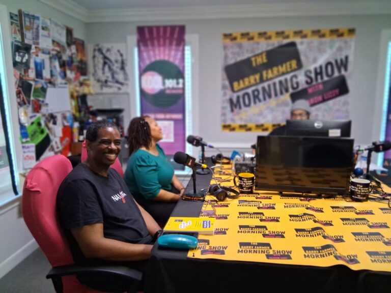 J.K. Lynch on air with the radio show crew