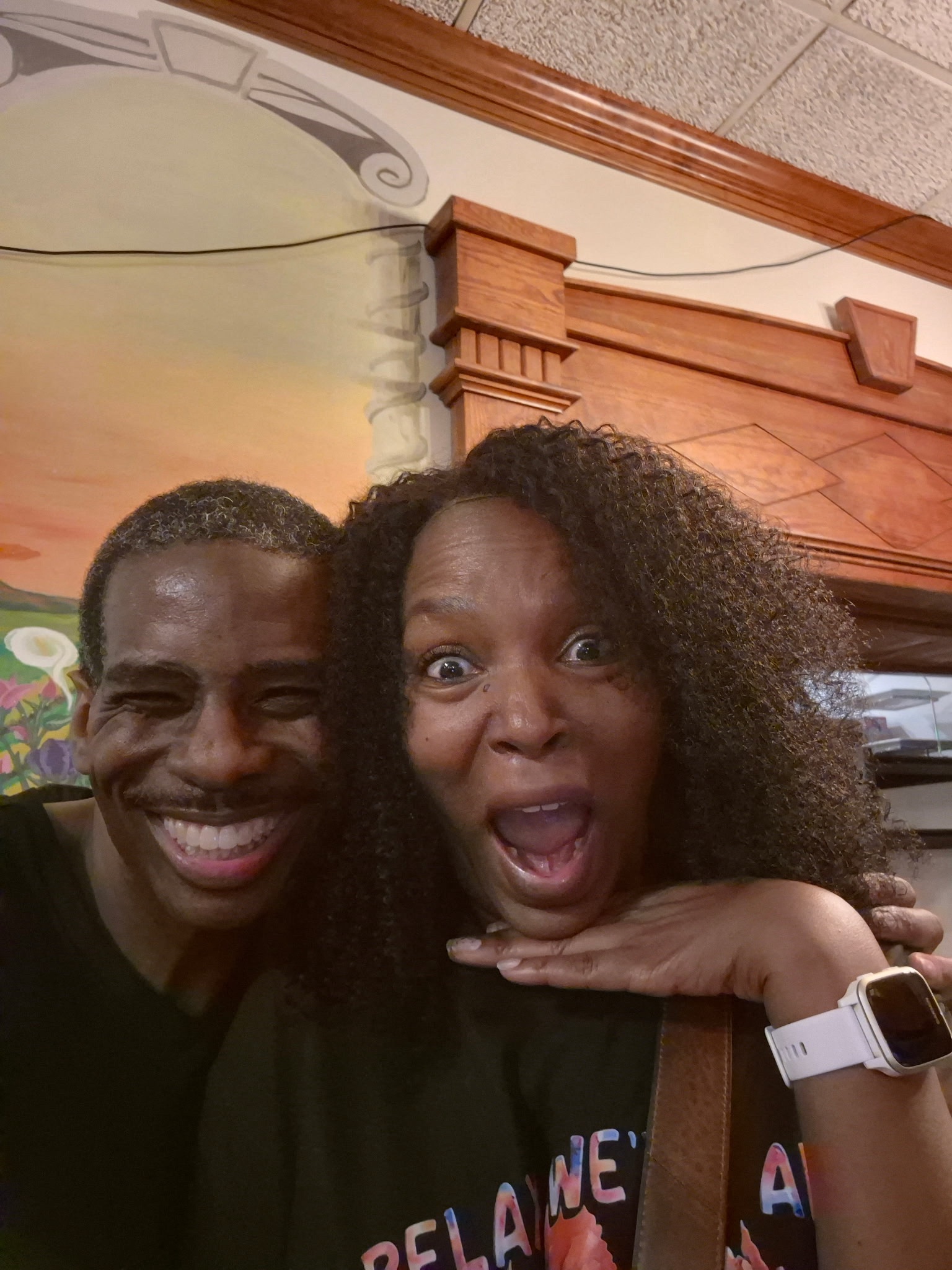 J.K. Lynch smiling with a friend